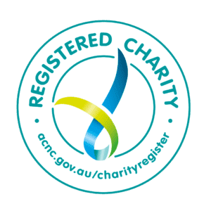 A circular logo with "Registered Charity" around the top, a blue and green ribbon in the center, and "acnc.gov.au/charityregister" at the bottom.